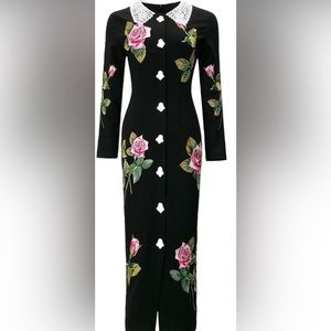 Vintage inspired black dress with embroidered flowers.